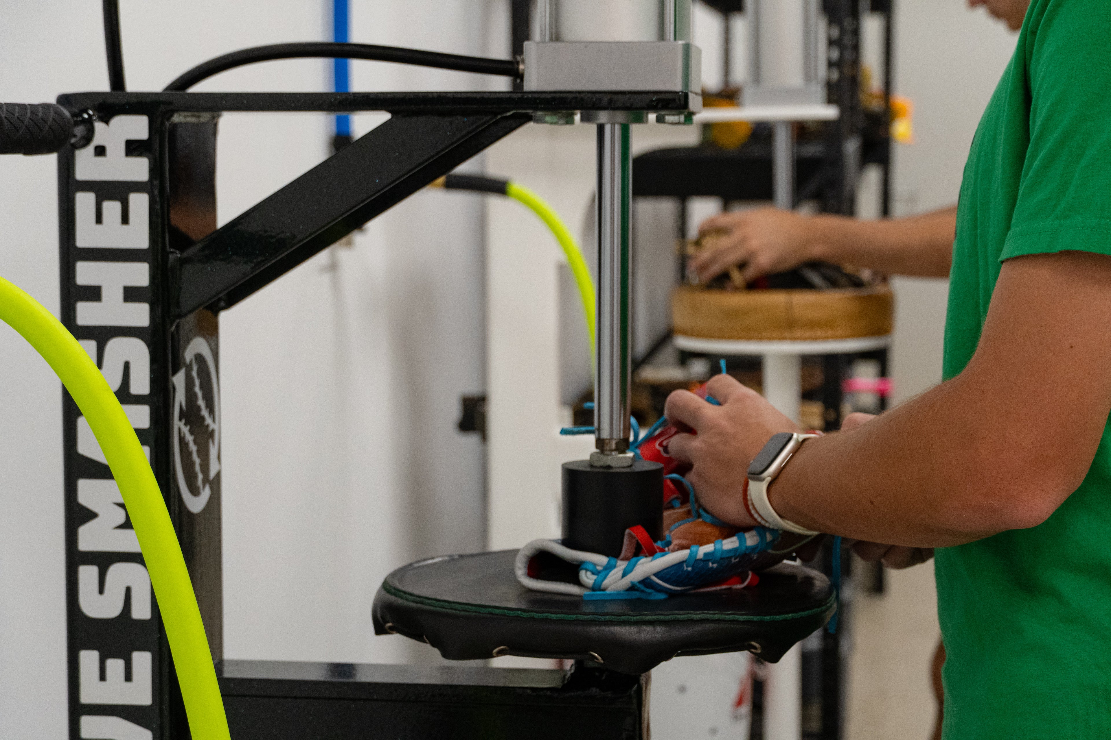 Professional glove craftsmen breaking in gloves